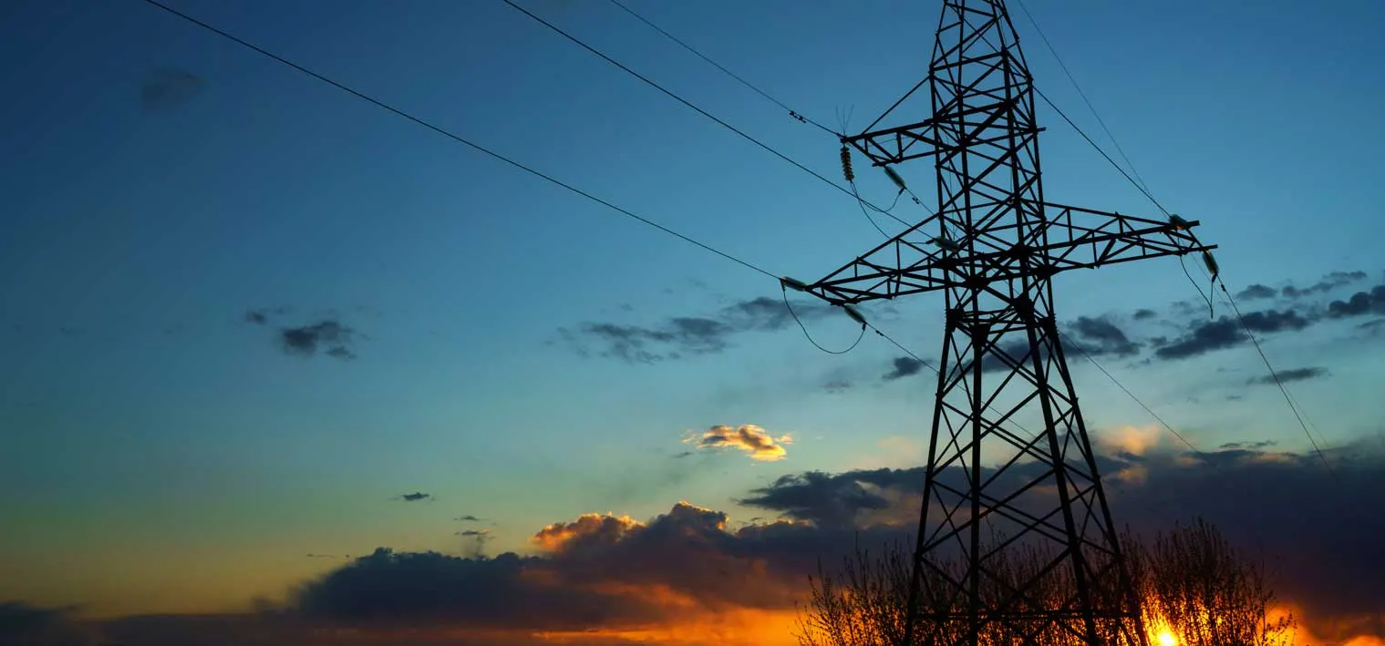 Electricity transmission towers at dusk